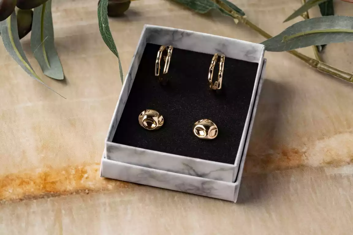 Gold earrings in jewelry box