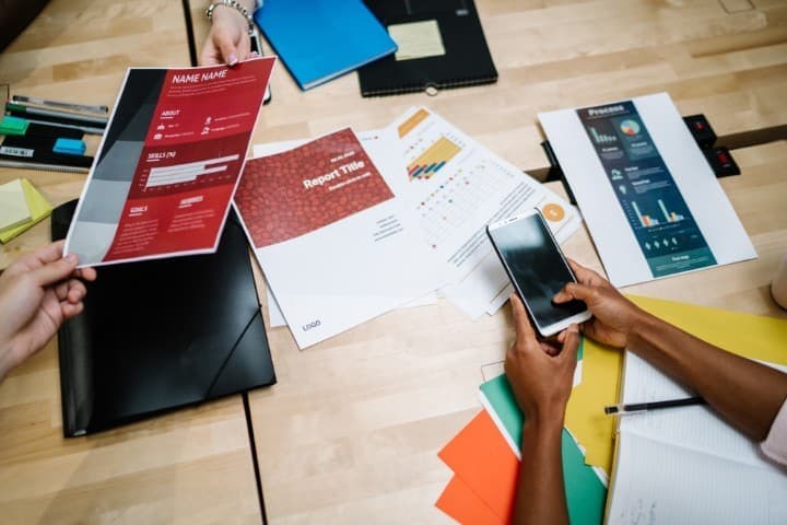 Team reviewing printed documents