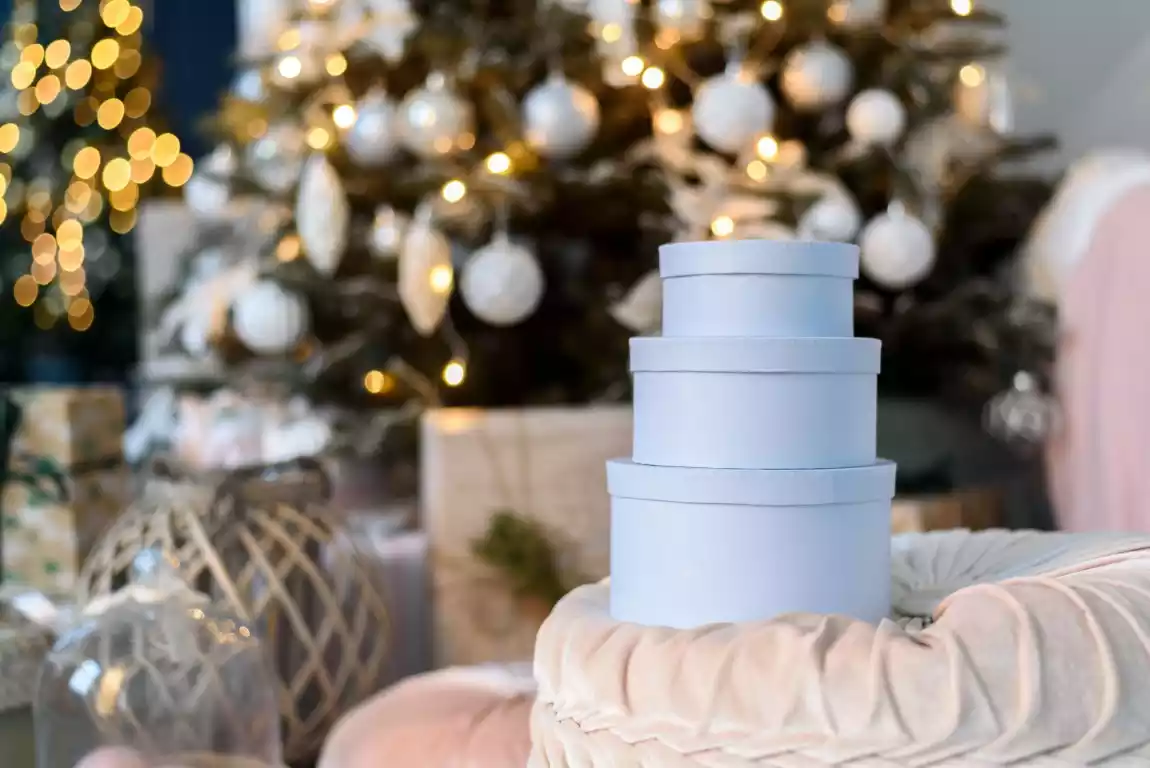 Stack of custom printed gift boxes with Christmas decorations